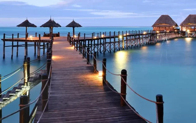 Coastal view of Zanzibar’s turquoise waters and white sandy beaches, part of a Kenya and Tanzania safari adventure.